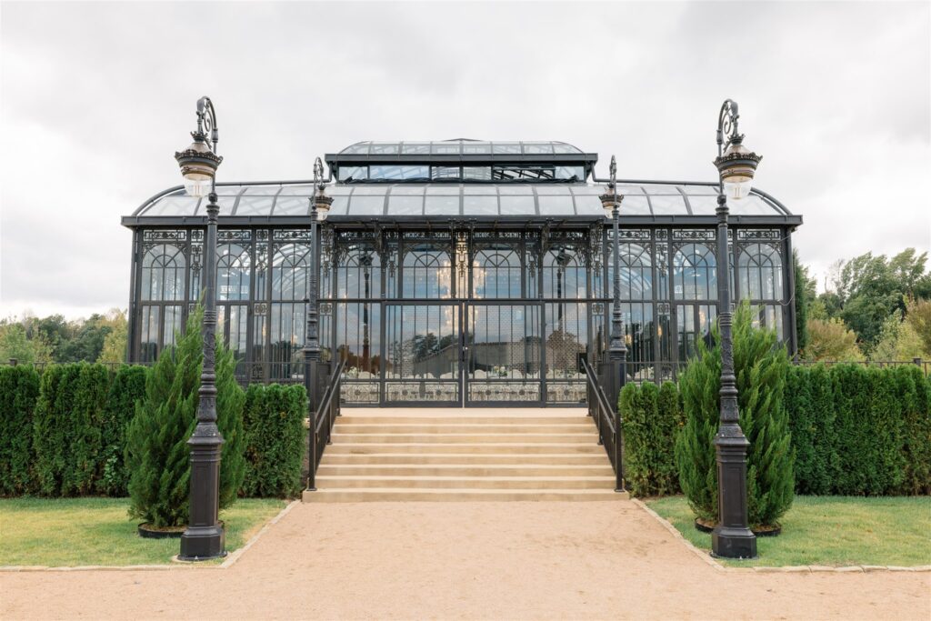 The all-glass and wrought-iron Conservatory at Blackberry Ridge in Trenton, Georgia evoking a European feel.