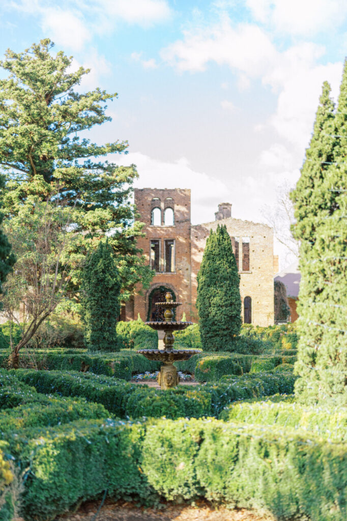 The Manor House Ruins of Barnsley Resort featuring a boxwood hedge maze garden water fountain at the center.