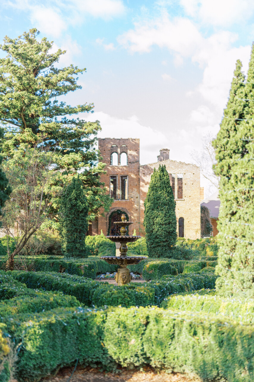 The Manor House Ruins of Barnsley Resort featuring a boxwood hedge maze garden water fountain at the center.